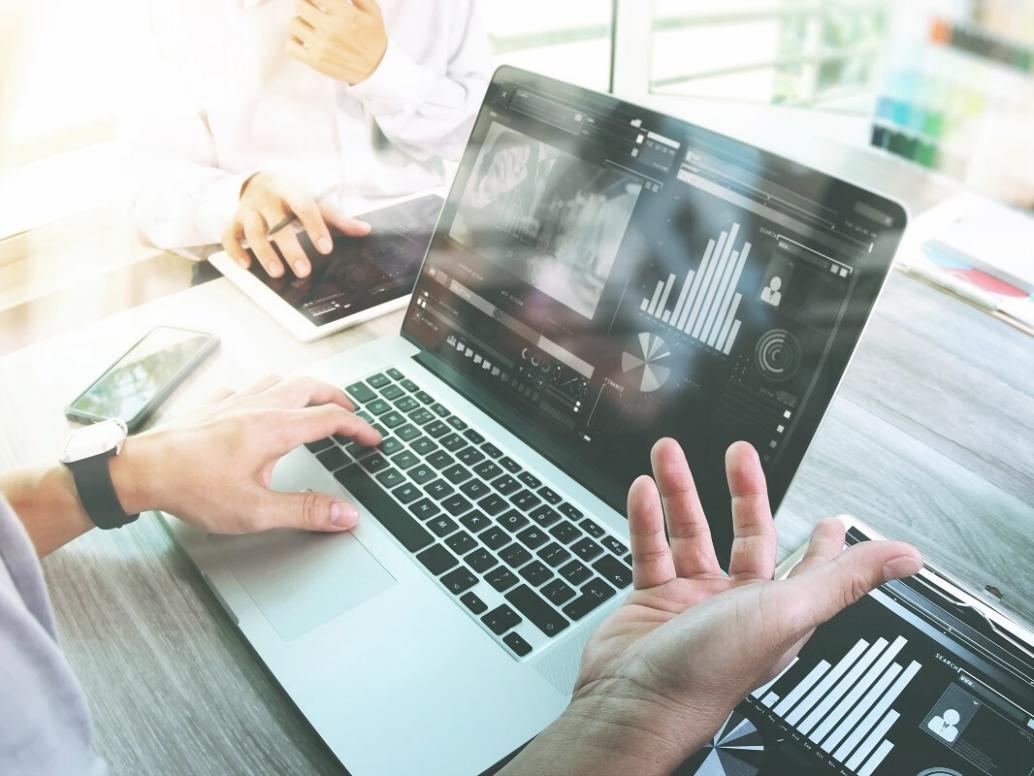 Student reviewing analytics dashboard showing SEO performance improvements